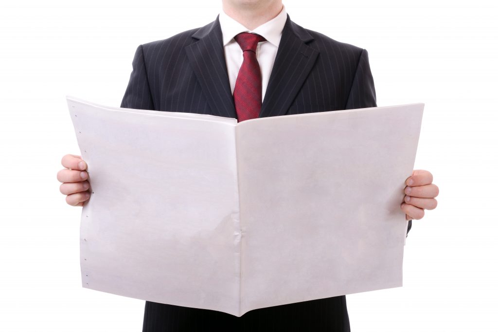 Businessman,Holding,A,Blank,News,Paper,Isolated,On,White